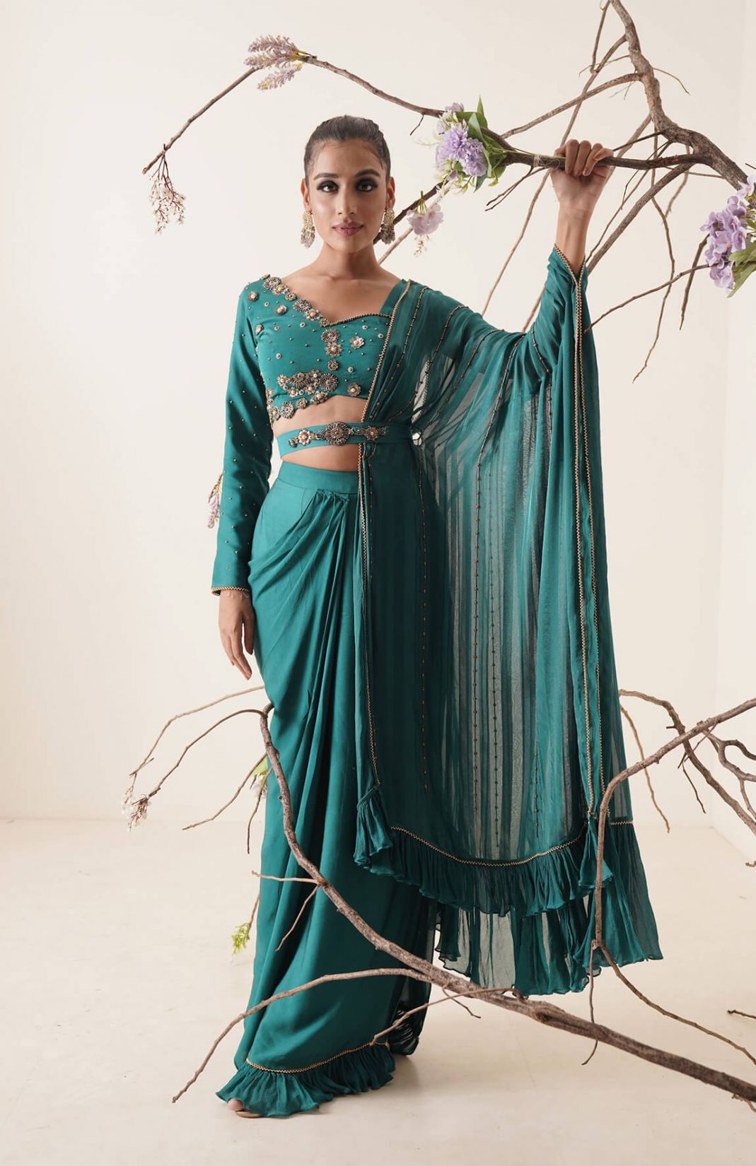 Teal Colour Pre-drape Saree With Waist Belt And Pallu Comes In A Full Sleeve Style.